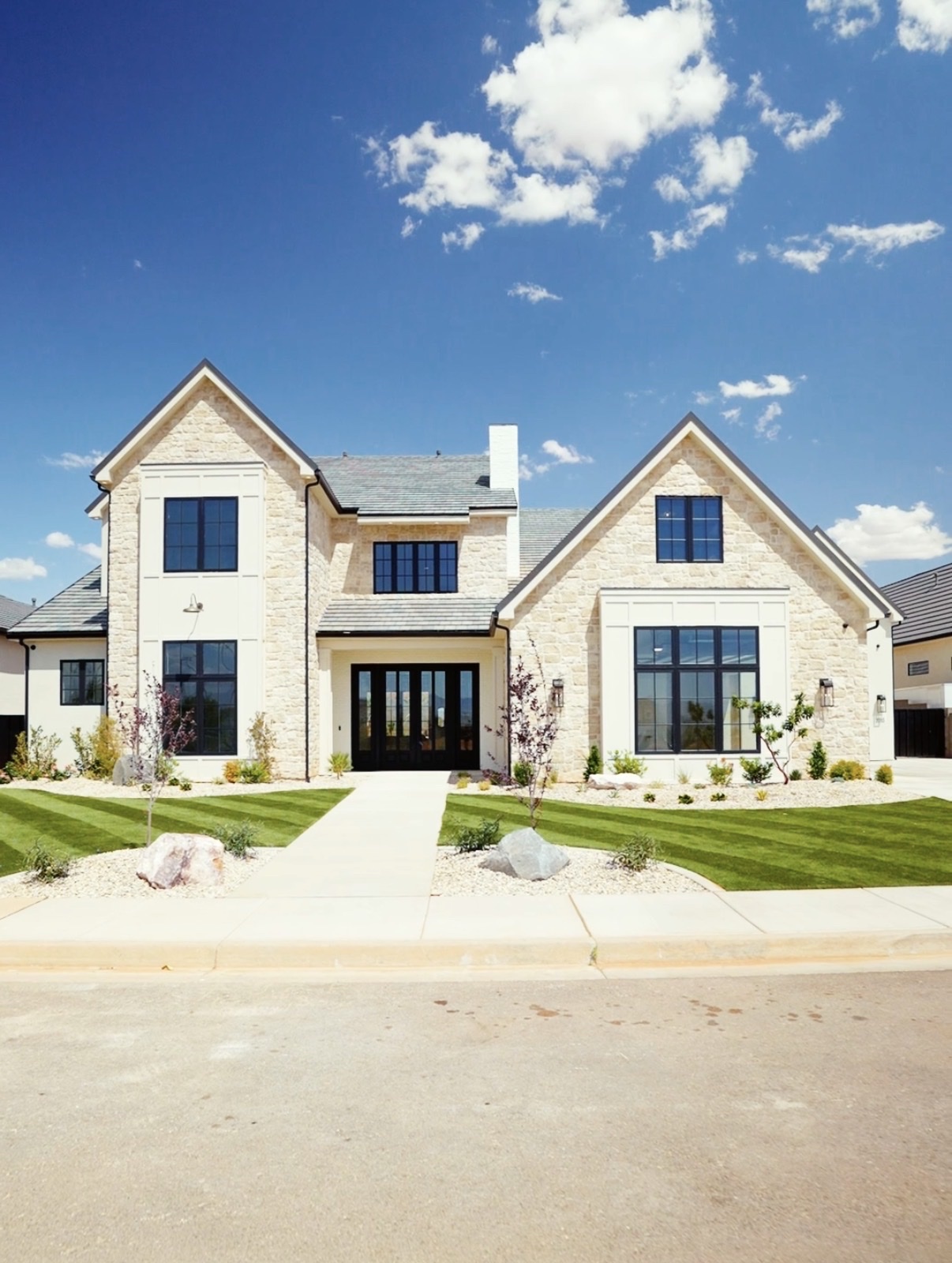A modern stone home with black window trim in Southern Utah, photographed by Steve Holm