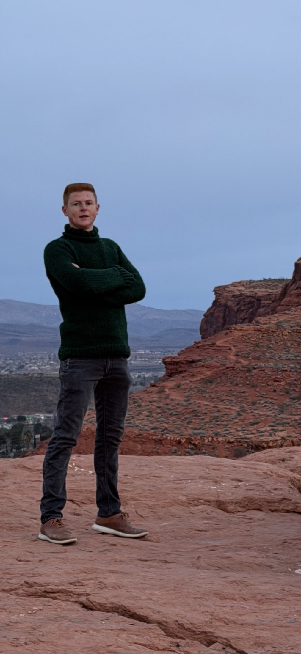 Steve Holm, St. George Realtor, standing on Dixie Rock above St. George, Utah